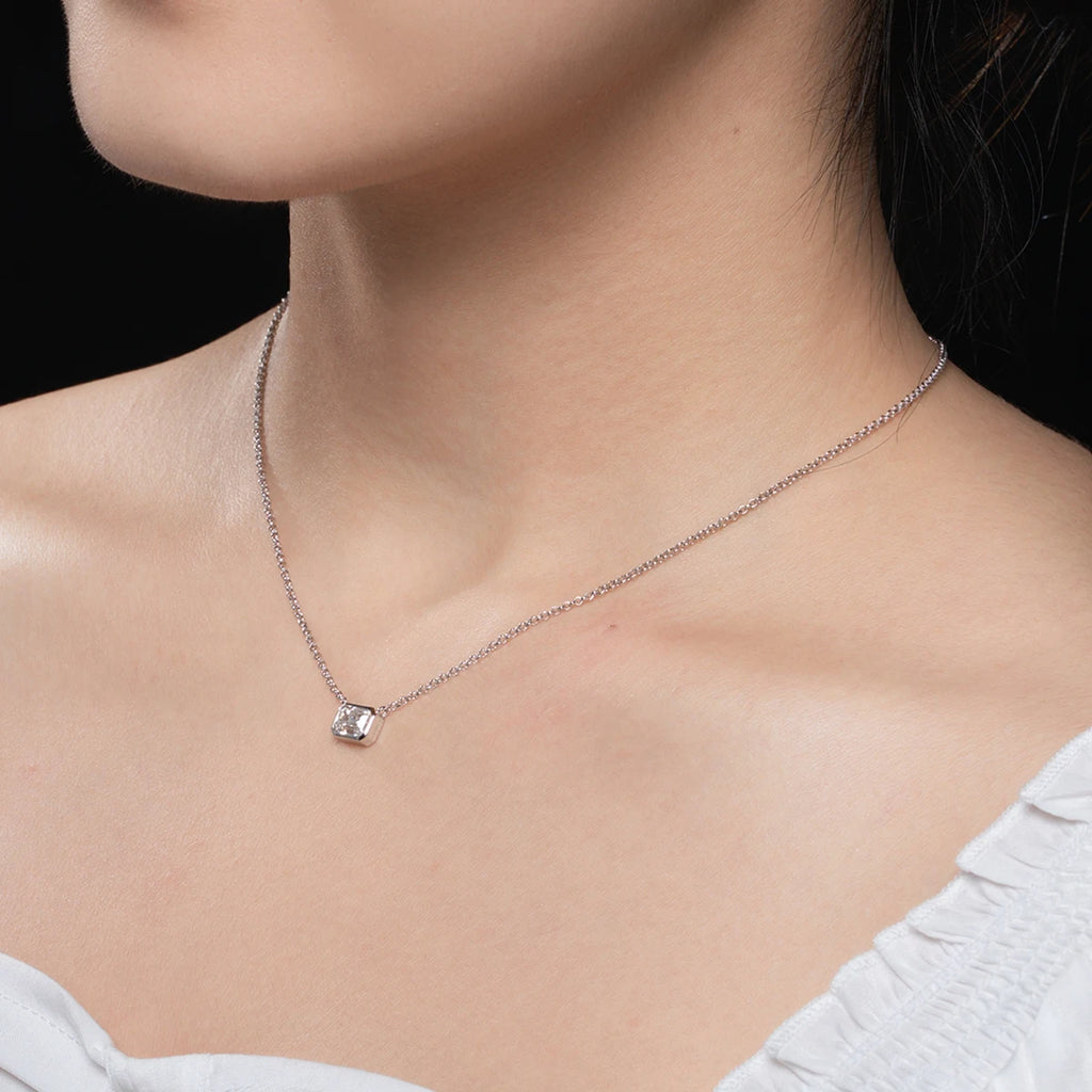 1ct emerald moissanite pendant, 18K gold plated, lifestyle shot — Aurora Moissanite
