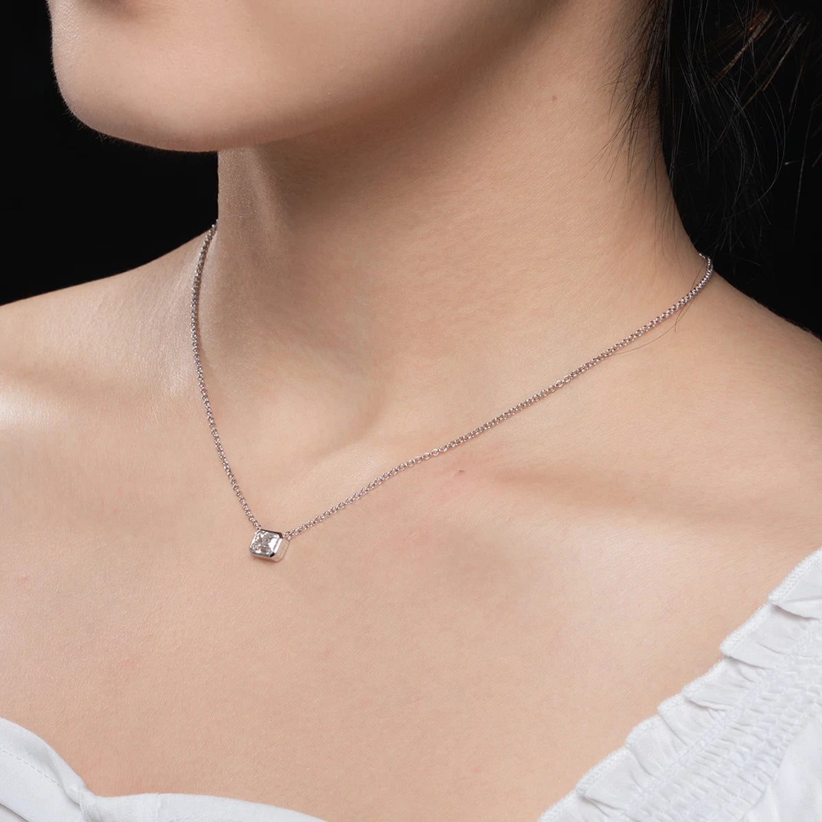 1ct emerald moissanite pendant, 18K gold plated, lifestyle shot — Aurora Moissanite