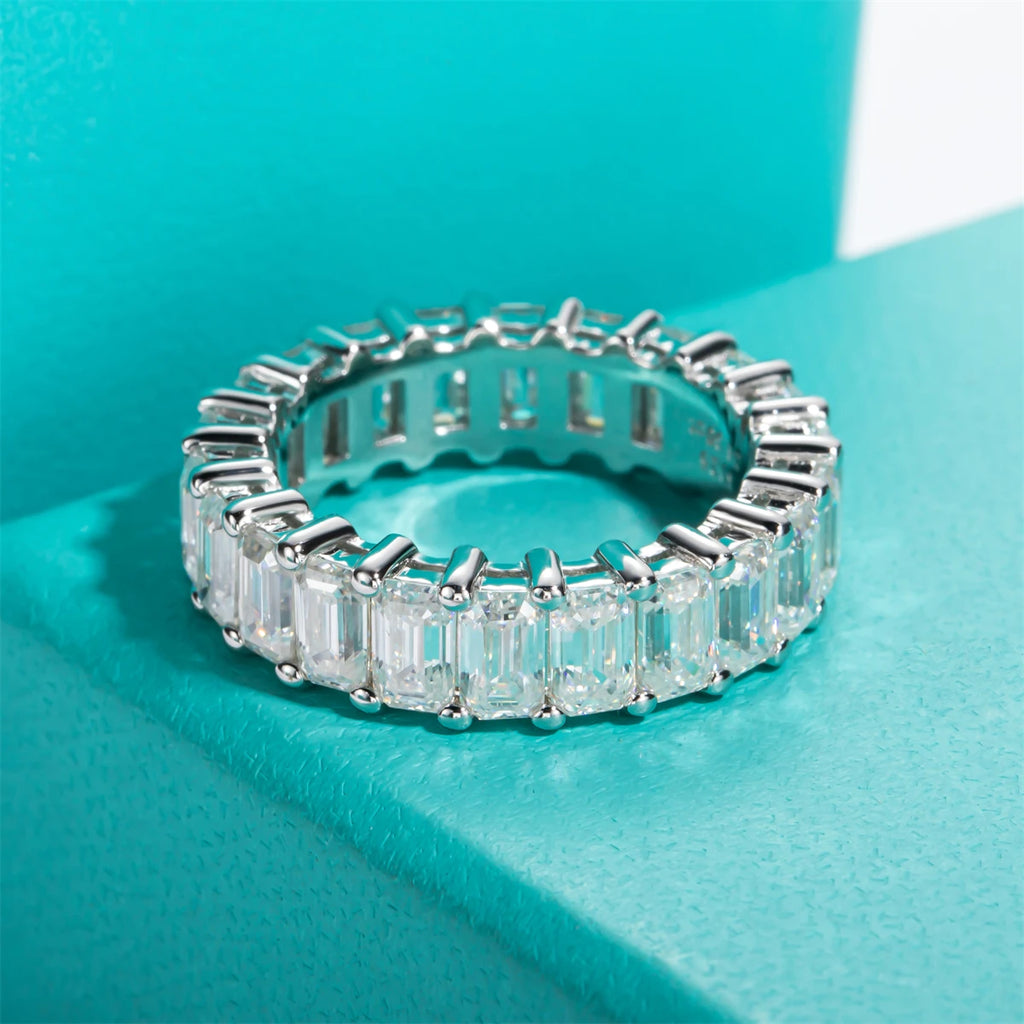 Emerald moissanite eternity band 8.1cttw D color VVS1, step facets visible — Aurora Moissanite