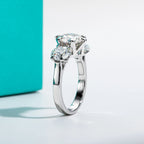 5ct three-stone moissanite ring, side profile, rhodium plated — Aurora Moissanite