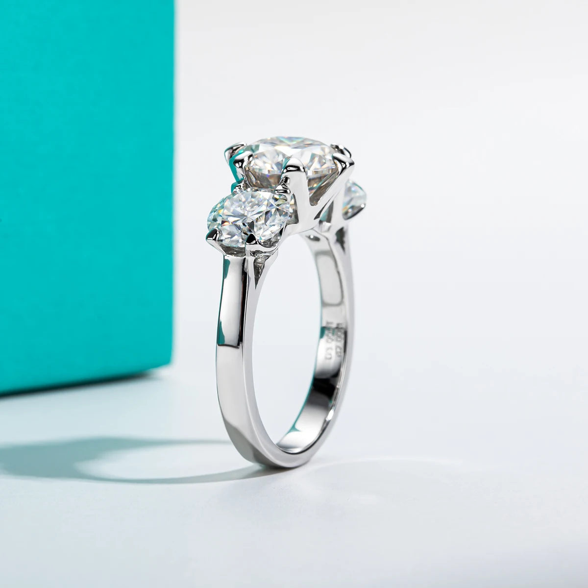 5ct three-stone moissanite ring, side profile, rhodium plated — Aurora Moissanite