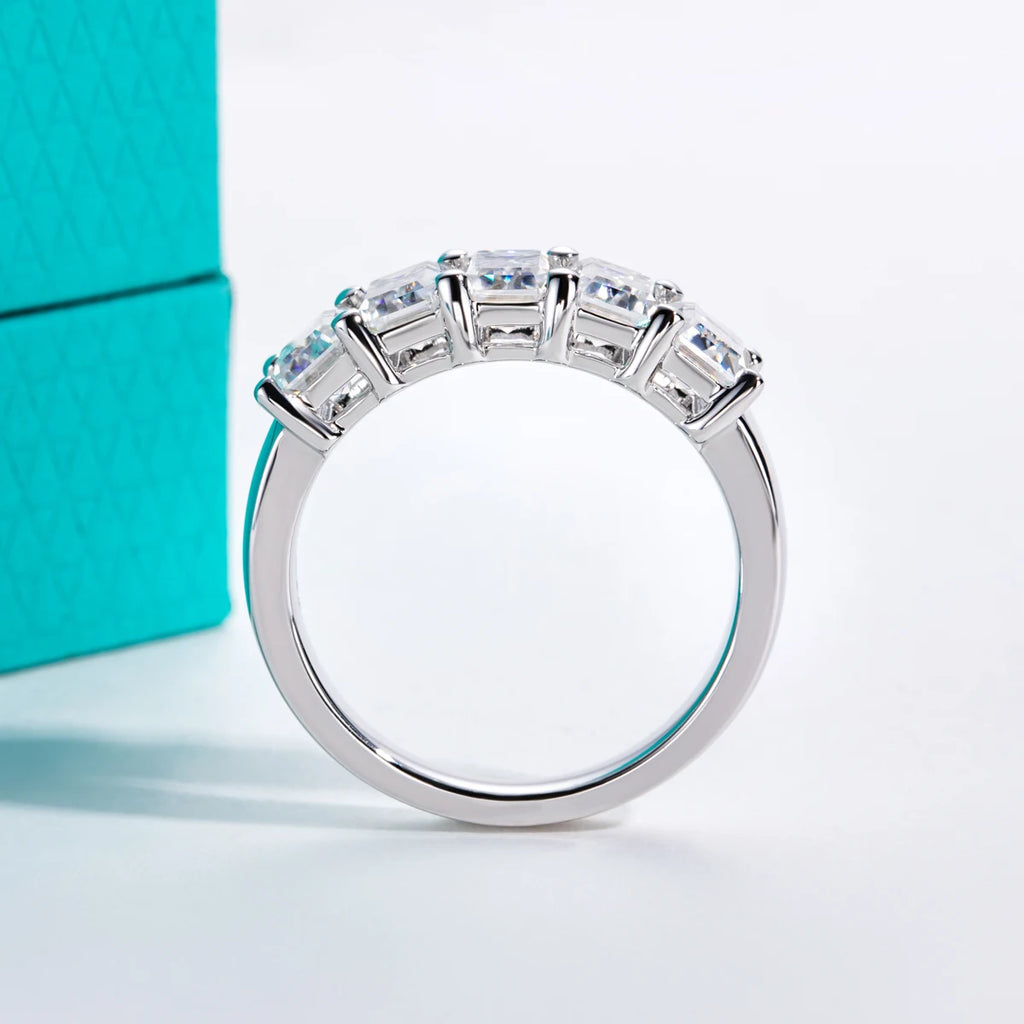 The Ember Band lifestyle — emerald moissanite wedding ring worn on finger — Aurora Moissanite