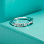 Moissanite bow tie band D color VVS1, knot design detail, sterling silver — Aurora Moissanite