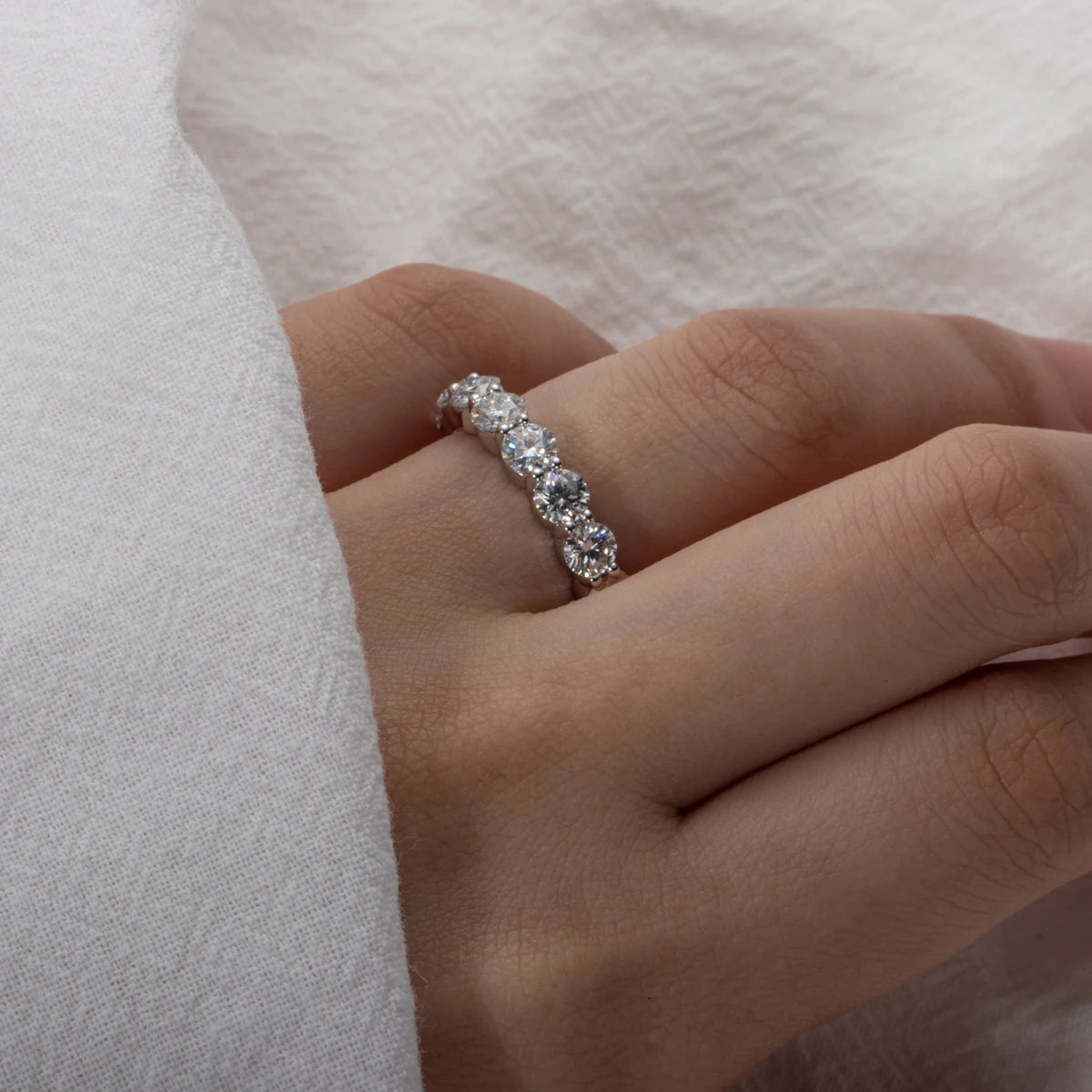 The Lux Band worn — 4mm 5cttw moissanite full eternity band, 18K gold — Aurora Moissanite
