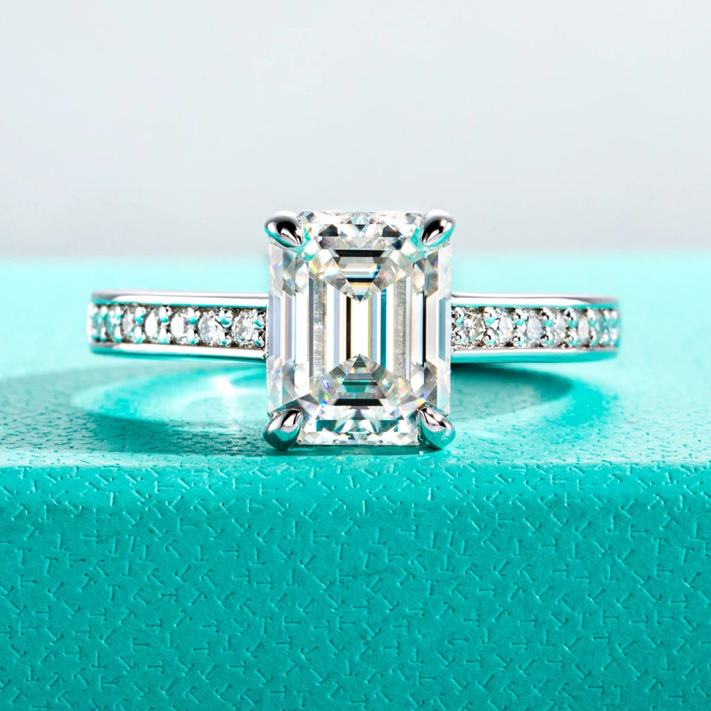 The Flare Ring worn — 3ct emerald cut moissanite solitaire, 18K gold plated — Aurora Moissanite