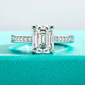 The Flare Ring worn — 3ct emerald cut moissanite solitaire, 18K gold plated — Aurora Moissanite