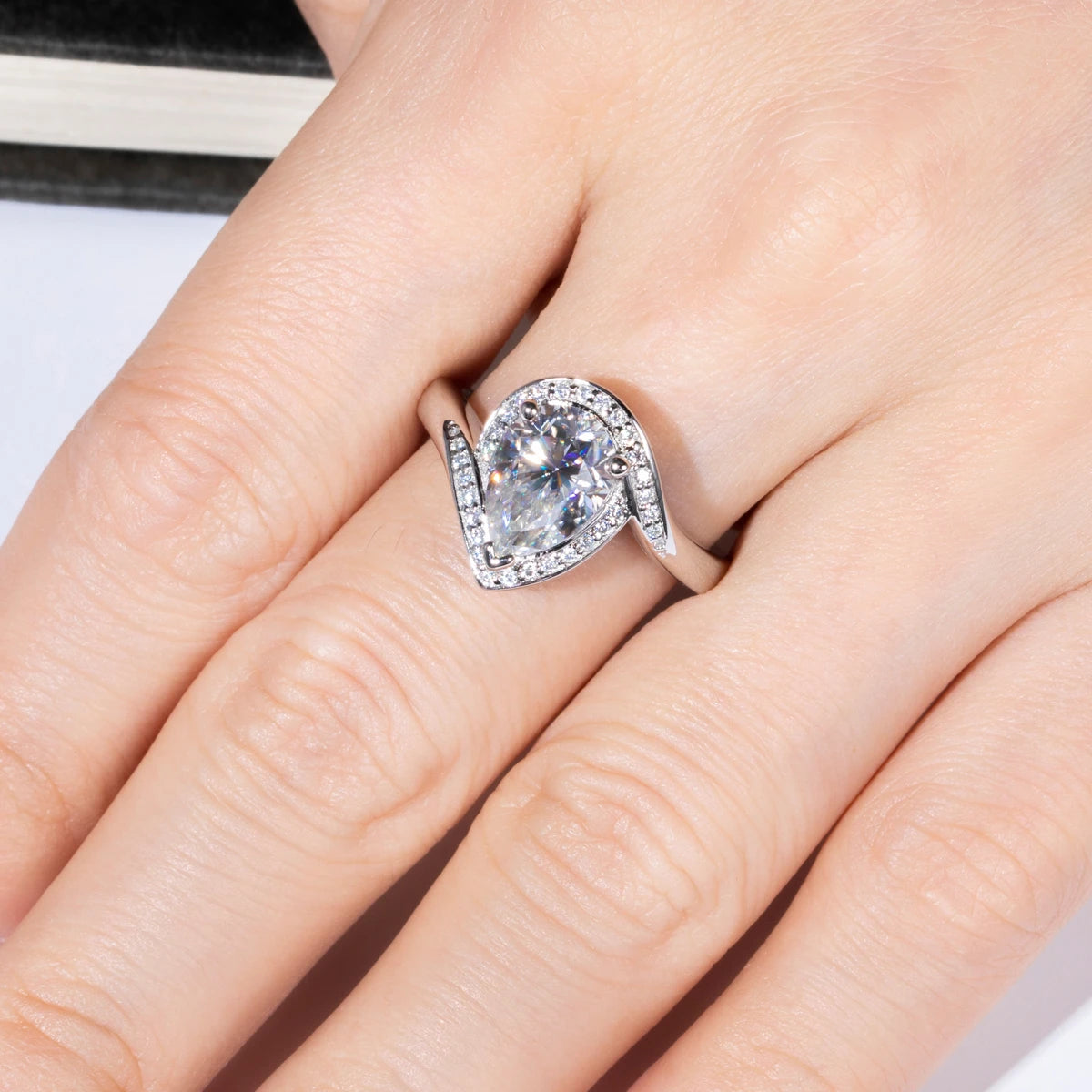 Pear halo moissanite ring top view, 2.5ct center with halo surround — Aurora Moissanite