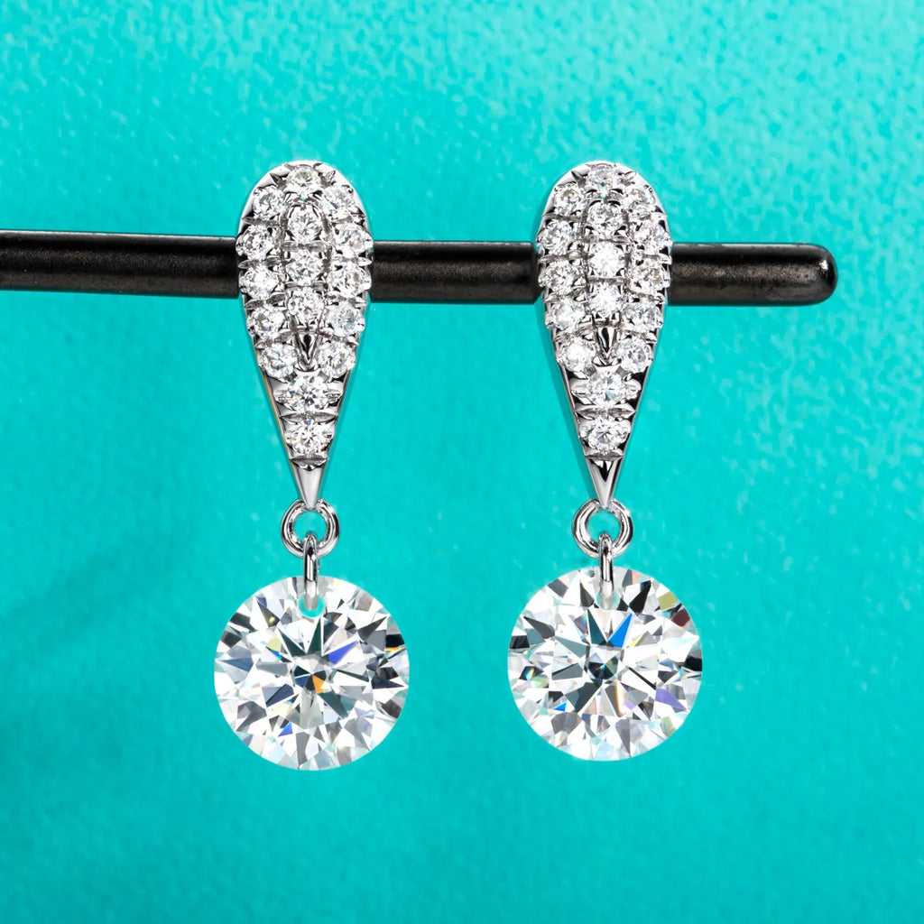 The Glow Earrings — 6cttw moissanite drops, front view, 18K gold — Aurora Moissanite