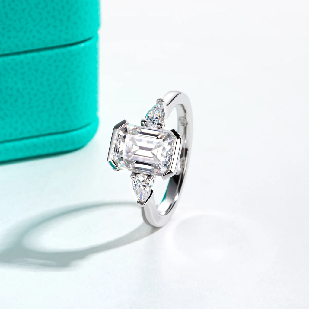 The Deia Ring worn — 3.6cttw emerald pear moissanite channel setting, 18K gold — Aurora Moissanite
