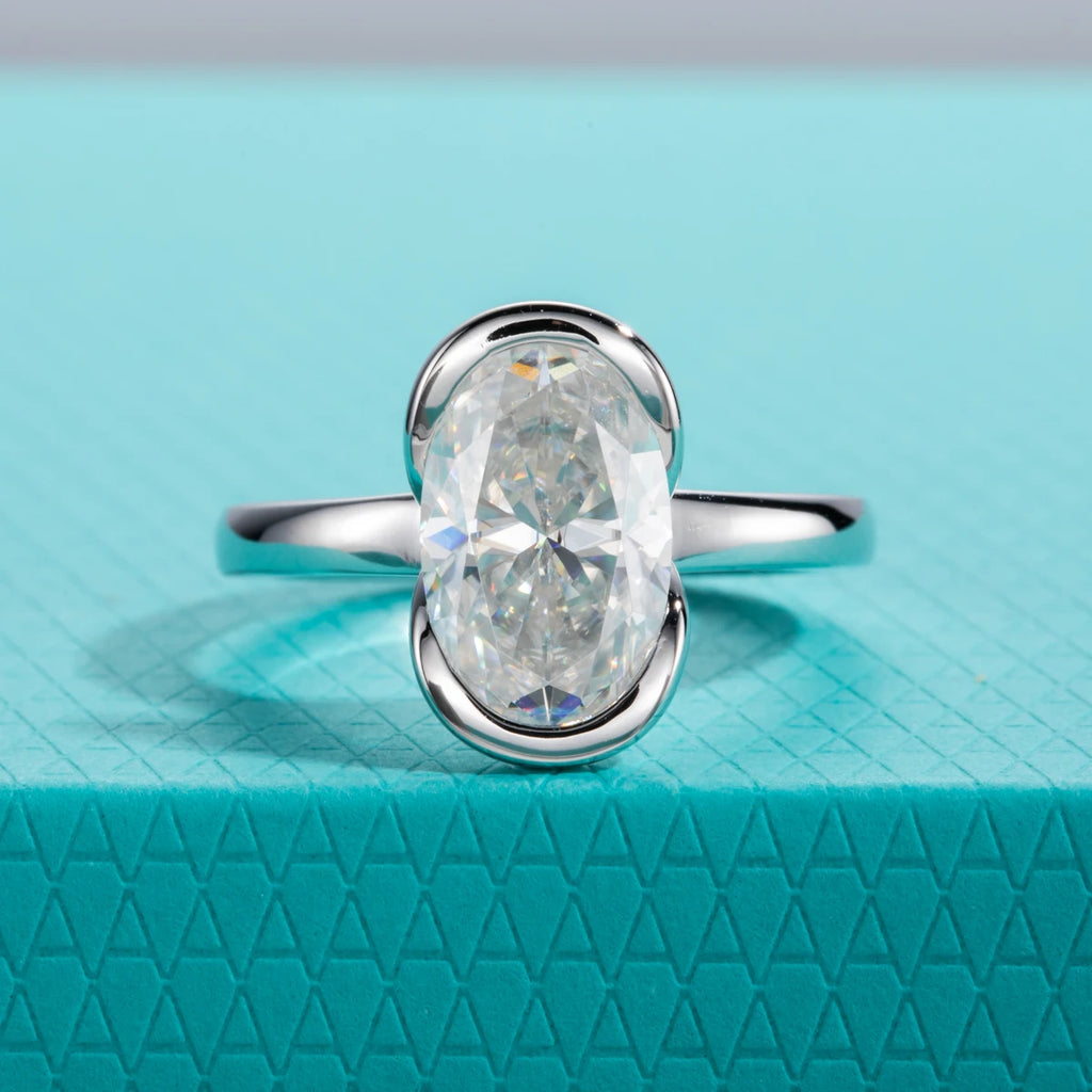 The Caer Ring worn — 3ct oval moissanite half-bezel, S925 — Aurora Moissanite