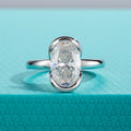 The Caer Ring worn — 3ct oval moissanite half-bezel, S925 — Aurora Moissanite