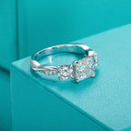 The Tove Ring lifestyle — princess three-stone moissanite ring worn on finger — Aurora Moissanite
