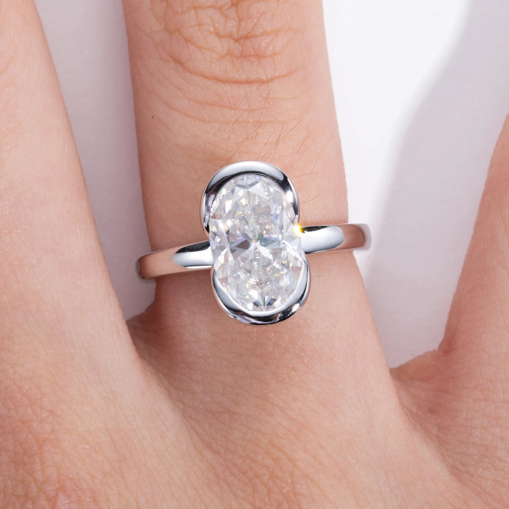 Oval moissanite half-bezel top view, 3ct D color — Aurora Moissanite