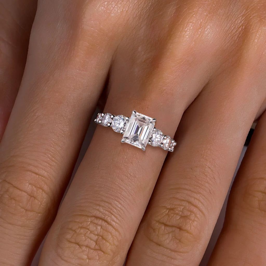 The Kess Ring lifestyle — 3ct emerald moissanite silver solitaire worn on finger — Aurora Moissanite