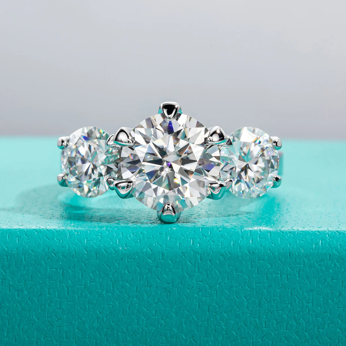 Three-stone moissanite 5cttw D color VVS1, rhodium plated — Aurora Moissanite