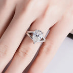 5ct pear moissanite solitaire top view, teardrop outline in prong setting — Aurora Moissanite