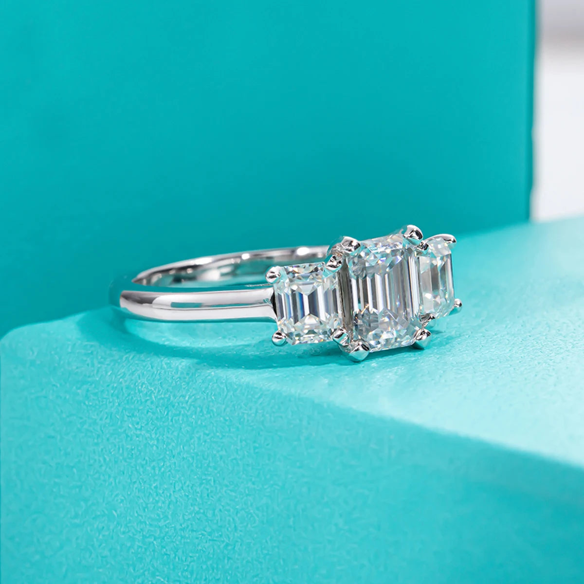 The Fen Ring lifestyle — 1.6ct emerald moissanite worn on finger — Aurora Moissanite