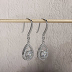 The Mael Earrings — 1ct teardrop moissanite hook drops, front — Aurora Moissanite