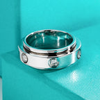 Moissanite fidget spinner ring 2.5mm D color VVS1, bezel setting outer band — Aurora Moissanite