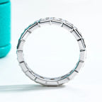 The Crest Band lifestyle — 2.2mm princess moissanite eternity ring on finger — Aurora Moissanite
