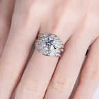 Angel wing moissanite ring top view, stones following wing curve — Aurora Moissanite