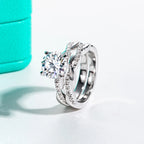 The Ines Ring worn — 3ct round moissanite infinity bridal set, 18K gold — Aurora Moissanite