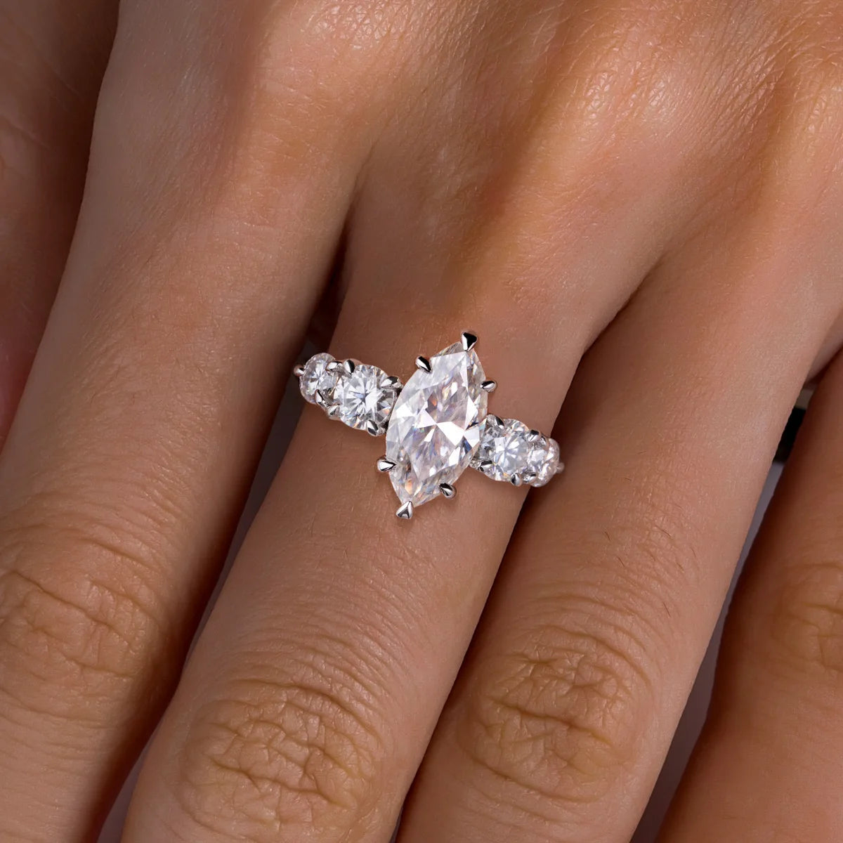 The Sora Ring lifestyle — marquise moissanite engagement ring worn on finger — Aurora Moissanite