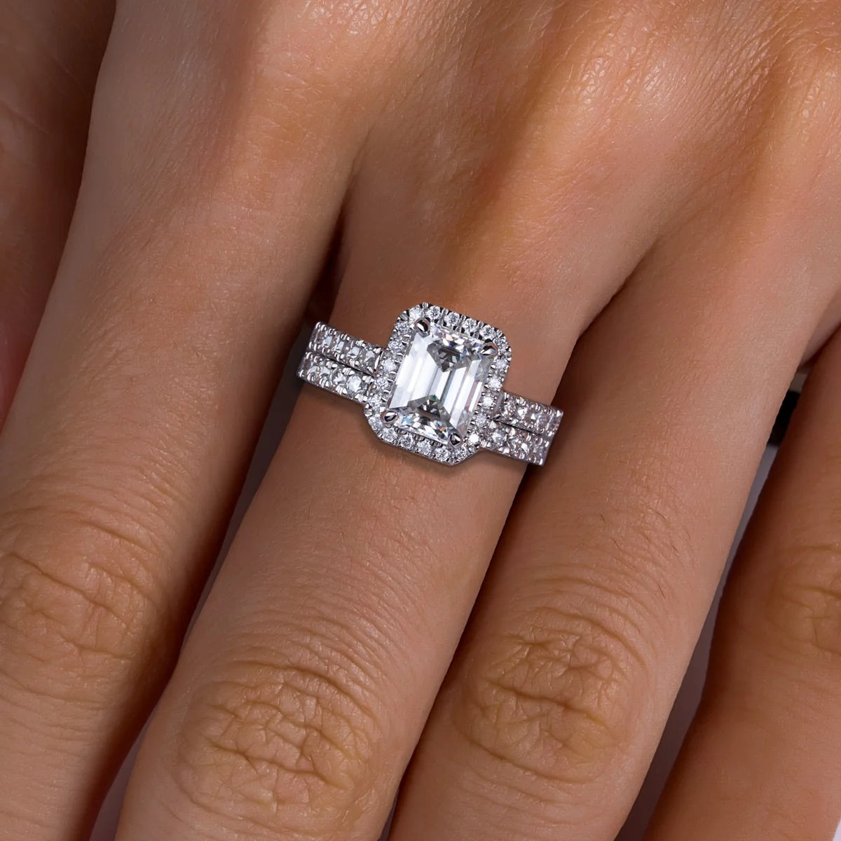 The Esse Ring lifestyle — emerald halo moissanite vintage bridal set worn on finger — Aurora Moissanite