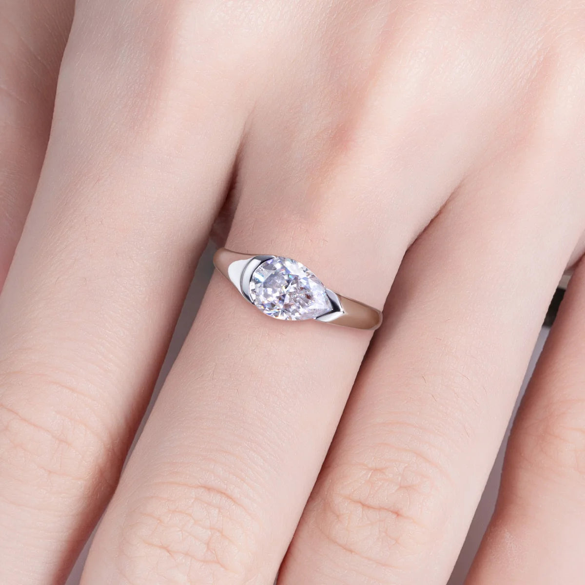 The Kade Ring lifestyle — 2.5ct pear moissanite tension mount worn on finger — Aurora Moissanite
