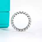 The Crest Band lifestyle — 3mm princess moissanite eternity ring worn on finger — Aurora Moissanite