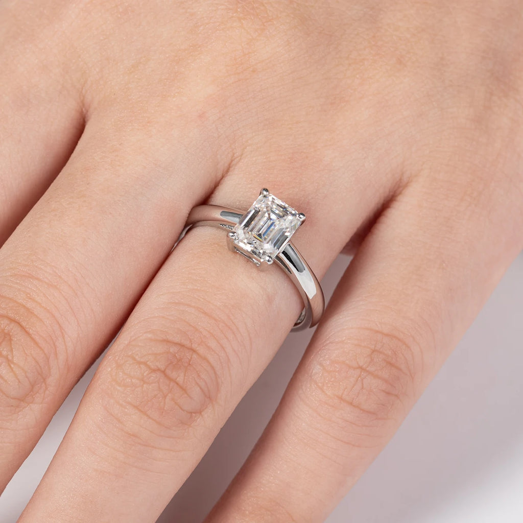 The Brae Ring worn — 2ct emerald cut moissanite solitaire, S925 — Aurora Moissanite