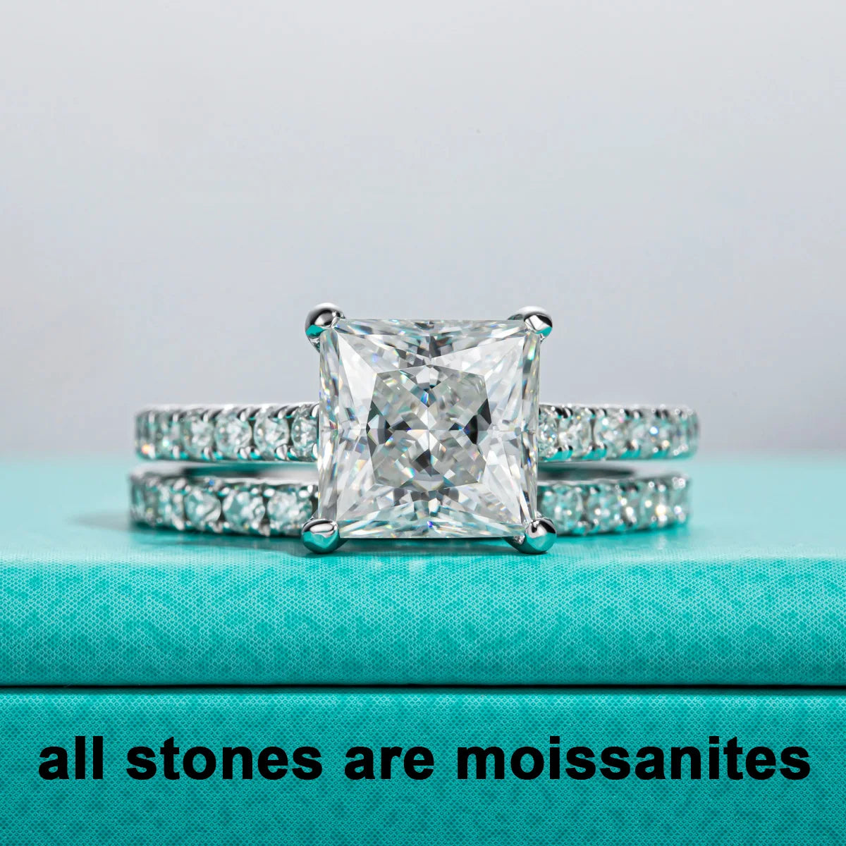 The Elen Ring worn — 3ct princess moissanite, 3-ring set on finger — Aurora Moissanite