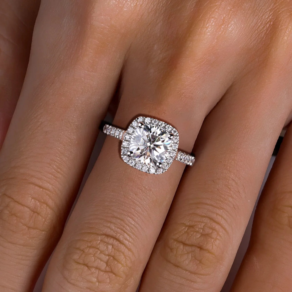 The Aela Ring lifestyle — cushion moissanite halo worn on finger — Aurora Moissanite