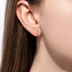The Fawn Earrings — 1.5mm moissanite huggie hoops, 14K yellow gold — Aurora Moissanite