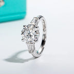 Three-stone moissanite 3.5ct center + 0.3ct side stones, D color VVS1 — Aurora Moissanite