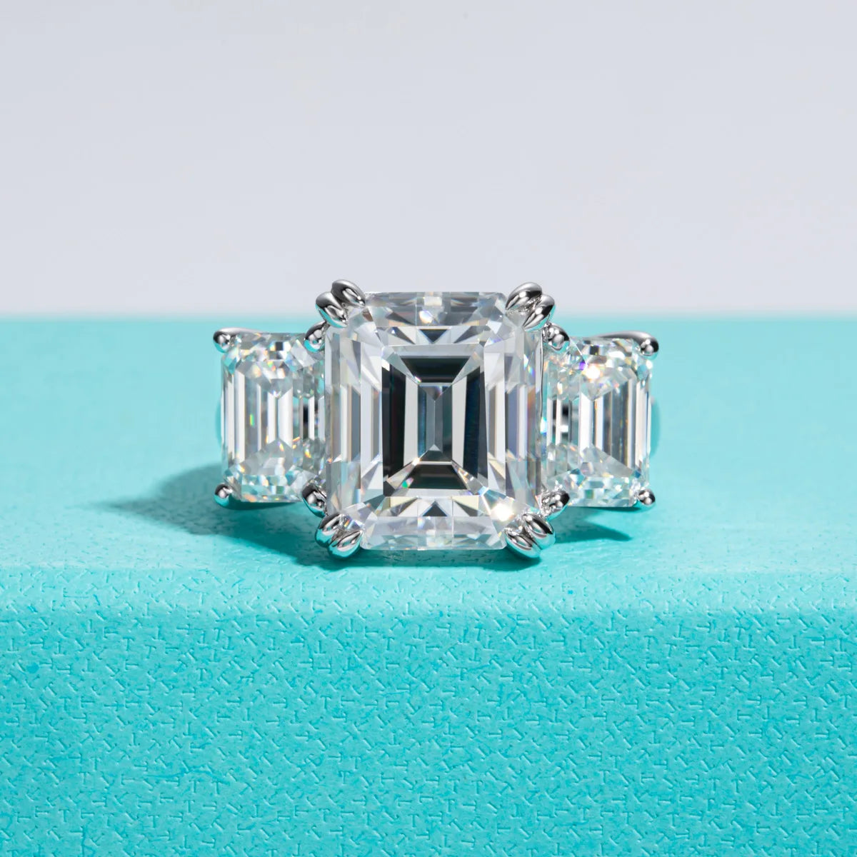 The Prism Ring — 12ct emerald moissanite 3-stone ring, front view — Aurora Moissanite
