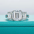 The Alva Ring worn — 5cttw emerald three-stone moissanite, S925 — Aurora Moissanite