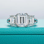 The Alva Ring worn — 5cttw emerald three-stone moissanite, S925 — Aurora Moissanite