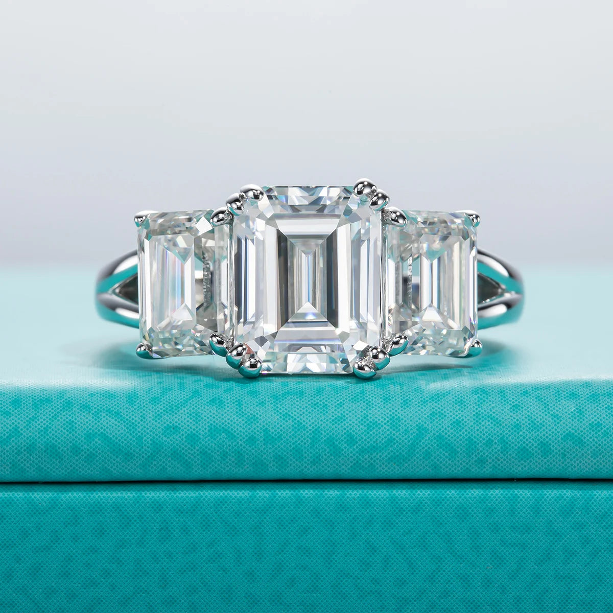 The Alva Ring worn — 5cttw emerald three-stone moissanite, S925 — Aurora Moissanite