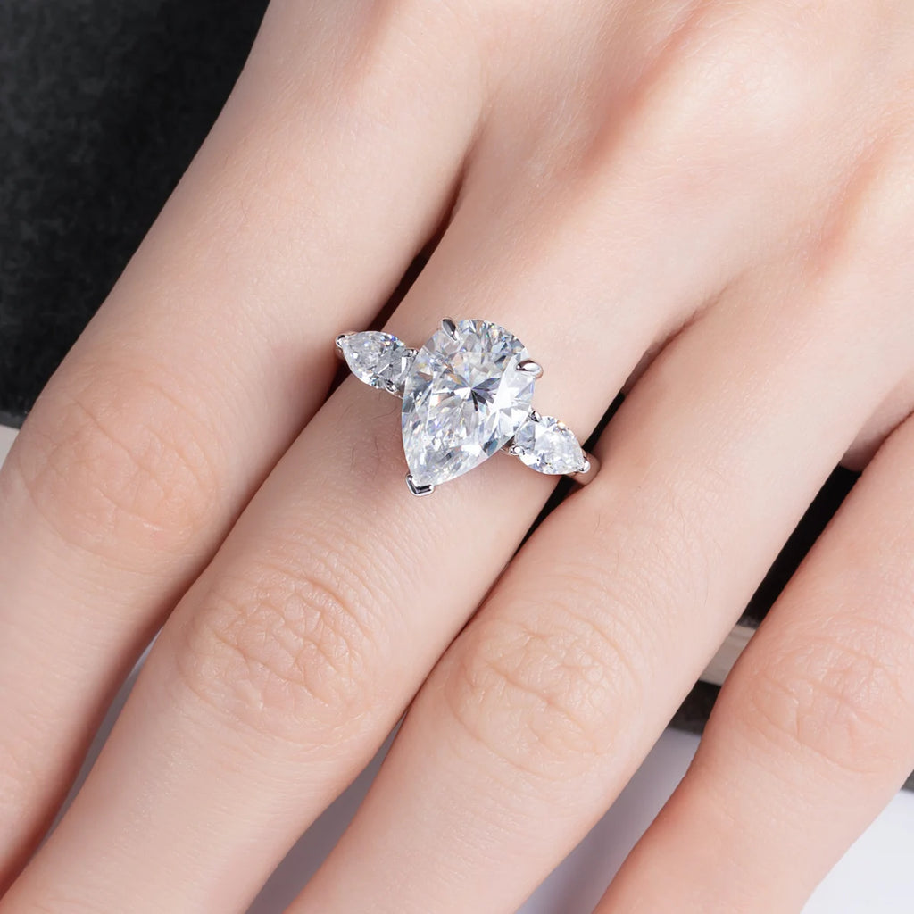 The Orla Ring worn — 6cttw pear moissanite, 18K gold plated, heaviest moissanite ring — Aurora Moissanite