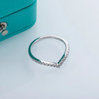 The Glow Band lifestyle — moissanite V-row formation ring worn on finger — Aurora Moissanite
