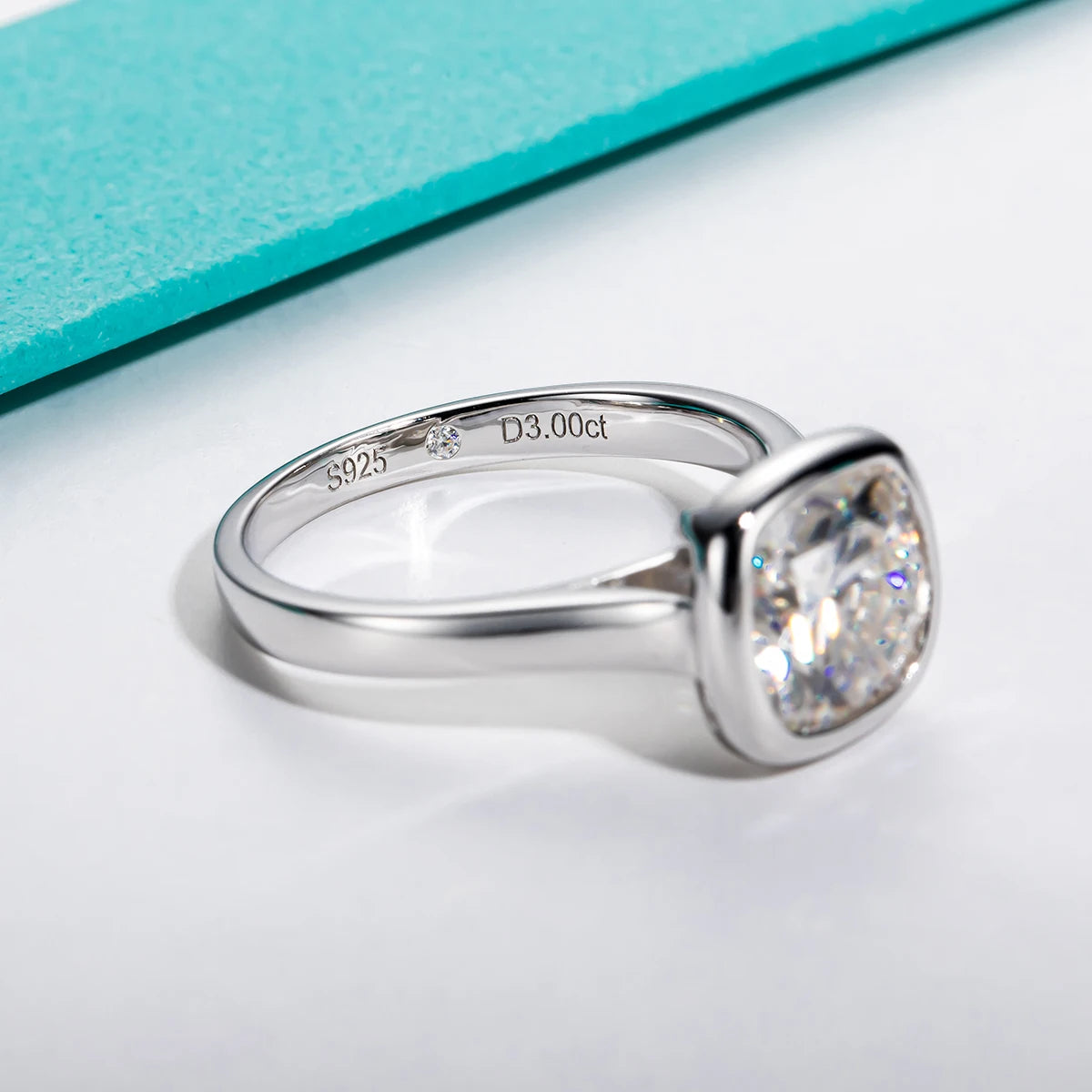 Cushion cut moissanite 3ct D color VVS1, continuous bezel setting detail — Aurora Moissanite
