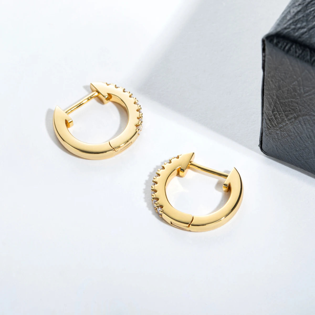The Fawn Earrings lifestyle — huggie hoop earrings worn — Aurora Moissanite