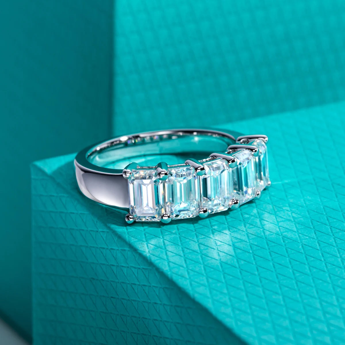 Emerald moissanite wedding band 3cttw D color VVS1, step facets visible — Aurora Moissanite