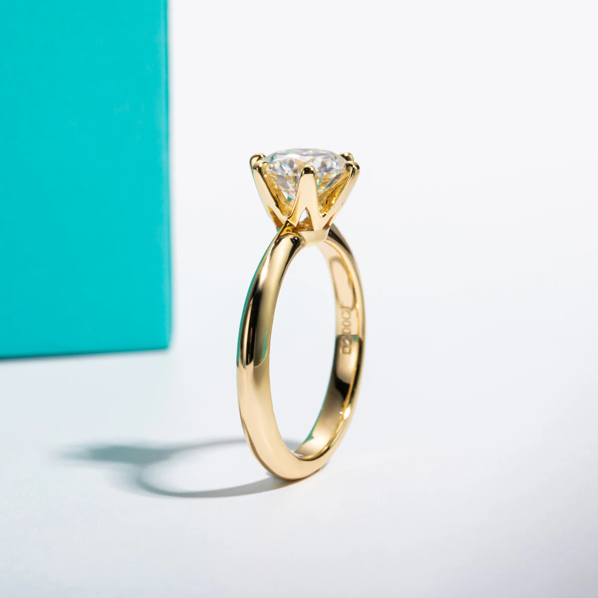 The Zael Ring lifestyle — yellow gold moissanite solitaire worn on finger — Aurora Moissanite