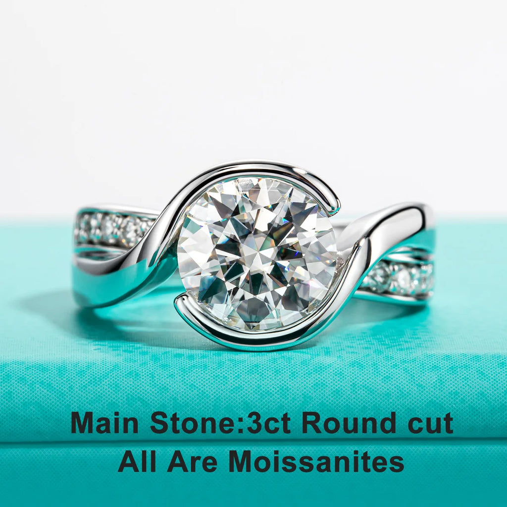 The Dara Ring worn — 3ct round moissanite bezel engagement ring, 18K gold — Aurora Moissanite
