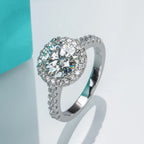 The Dwyn Ring — 2ct round moissanite halo, front view, 18K white gold — Aurora Moissanite