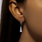 The Wisp Earrings lifestyle — moissanite dangle drops worn — Aurora Moissanite