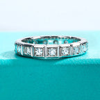 The Crest Band — 2.2mm princess moissanite eternity ring, front view — Aurora Moissanite