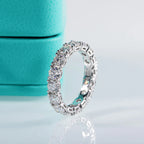 The Lux Band — 4mm moissanite eternity ring, front view, rhodium plated — Aurora Moissanite